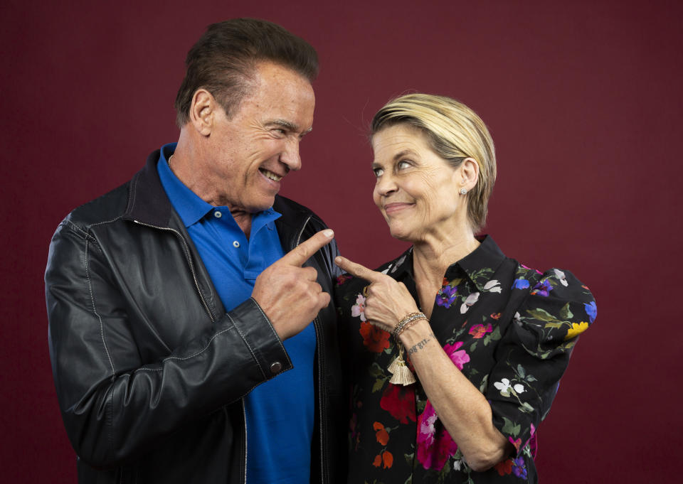 This Oct. 26, 2019 photo shows actor Arnold Schwarzenegger, left, and actress Linda Hamilton posing for a portrait to promote the film, "Terminator: Dark Fate" at the Four Seasons Hotel Los Angeles at Beverly Hills in Los Angeles. (Photo by Willy Sanjuan/Invision/AP)