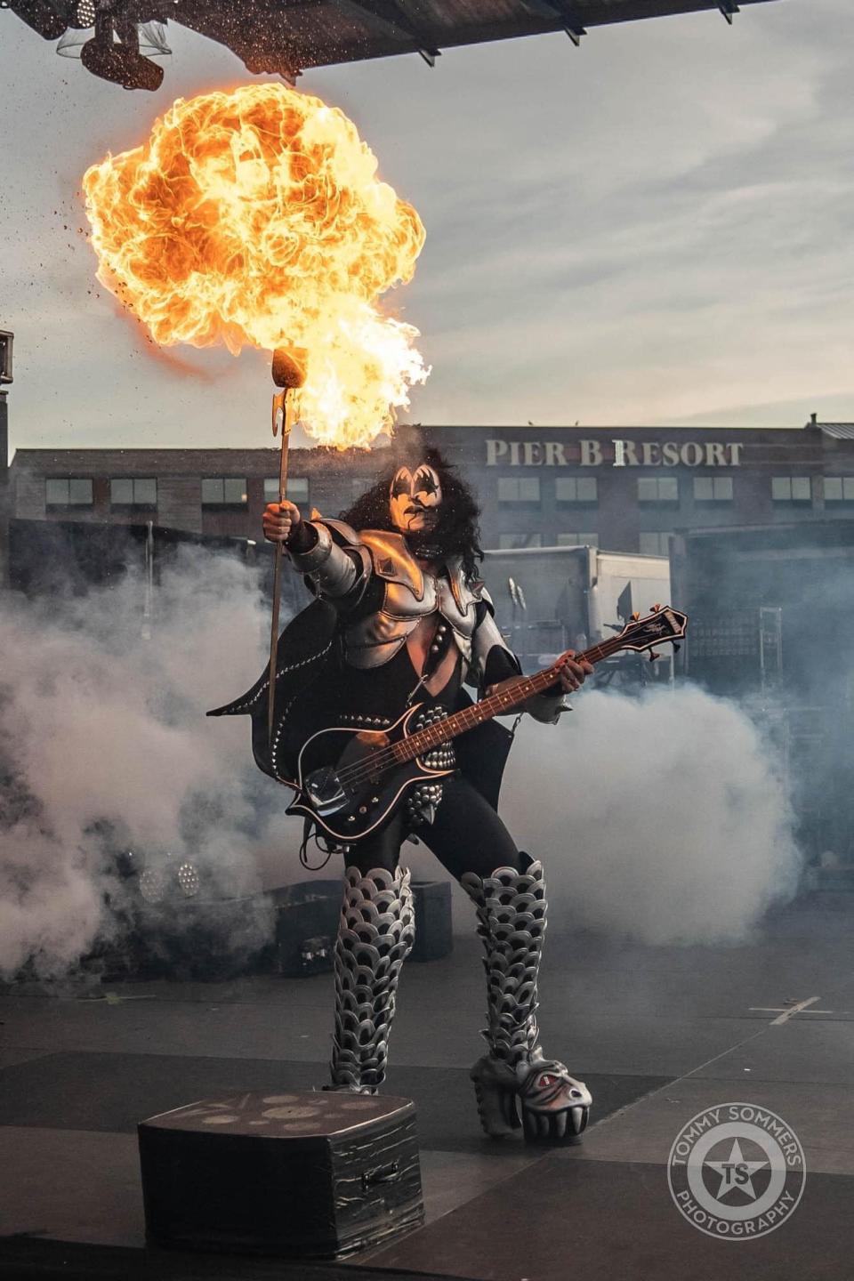 A member of Hairball performs as Gene Simmons with KISS.