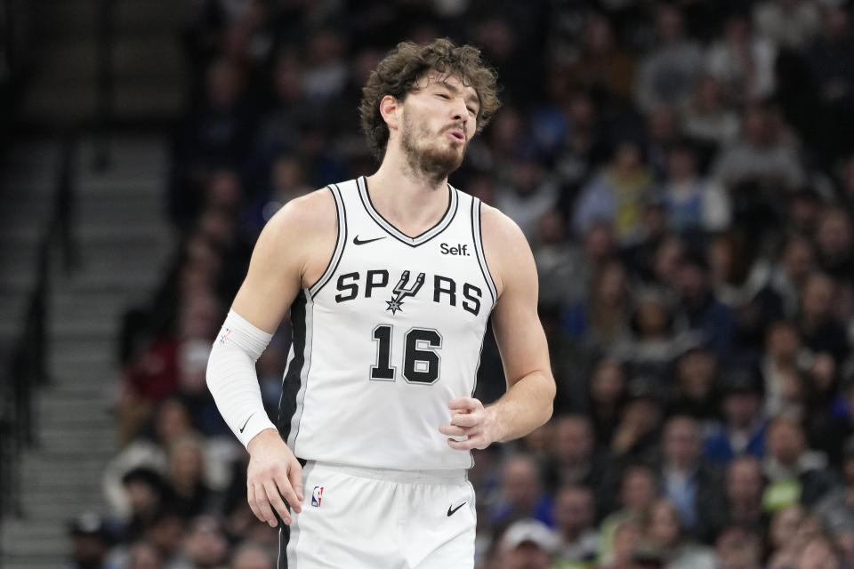 San Antonio Spurs forward Cedi Osman (16) reacts after missing a shot attempt during the second half of an NBA basketball game against the Minnesota Timberwolves, Wednesday, Dec. 6, 2023, in Minneapolis. (AP Photo/Abbie Parr)