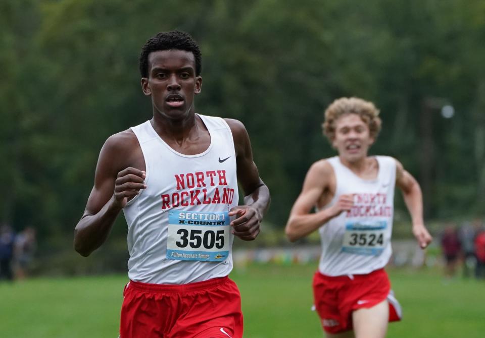 North Rockland's Claudel Chery, left, and Ryan Tuohy sprint to the finish in the Boys Varsity B 3-mile run at the Suffern Invitational at Bear Mountain State Park in Tomkins Cove on Saturday, September 23, 2023. Chery won with a 15:02.4 time.