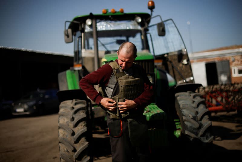 Ukrainian farmer wears body armour to plough frontline fields