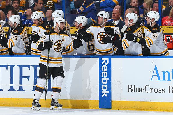 ST. LOUIS, MO - APRIL 1: David Krejci #46 of the Boston Bruins is congratulated after scoring a goal against the St. Louis Blues at the Scottrade Center on April 1, 2016 in St. Louis, Missouri.  (Photo by Dilip Vishwanat/NHLI via Getty Images)