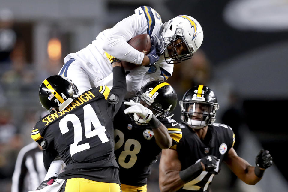Los Angeles Chargers wide receiver Tyrell Williams (16) makes a catch over Pittsburgh Steelers cornerback Coty Sensabaugh (24) in the first half of an NFL football game, Sunday, Dec. 2, 2018, in Pittsburgh. (AP Photo/Don Wright)