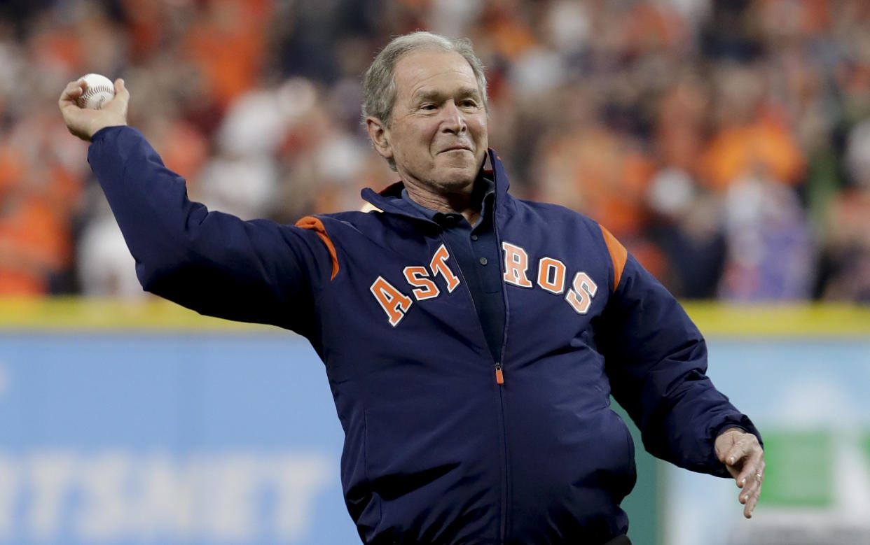 Former President George W. Bush throws the ceremonial first pitch before Game 5 of baseball’s World Series between the Houston Astros and the Los Angeles Dodgers Sunday, Oct. 29, 2017, in Houston. (AP Photo/Matt Slocum)