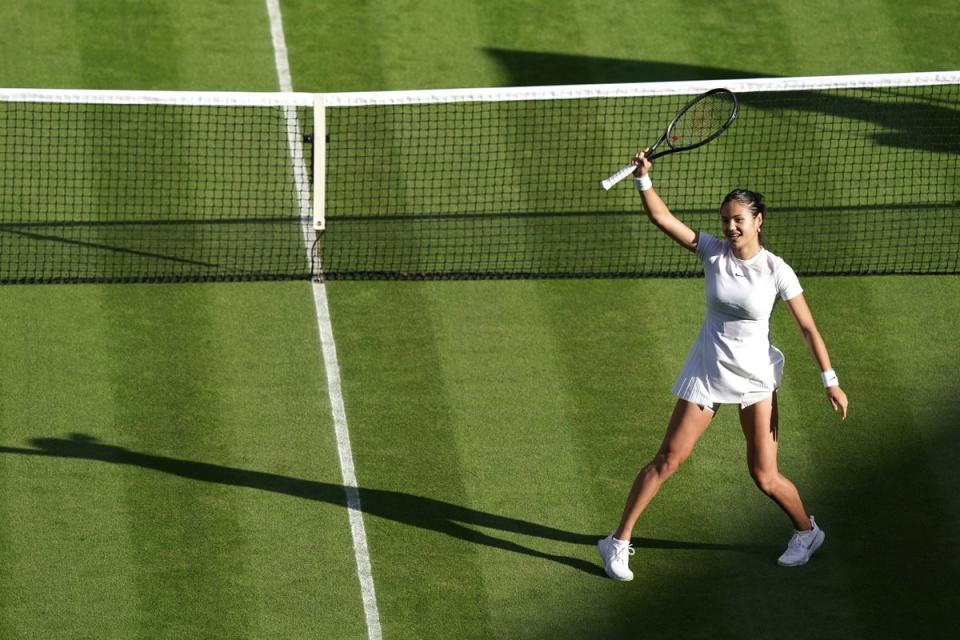 Emma Raducanu waves to Centre Court after her debut victory (Aaron Chown/PA) (PA Wire)