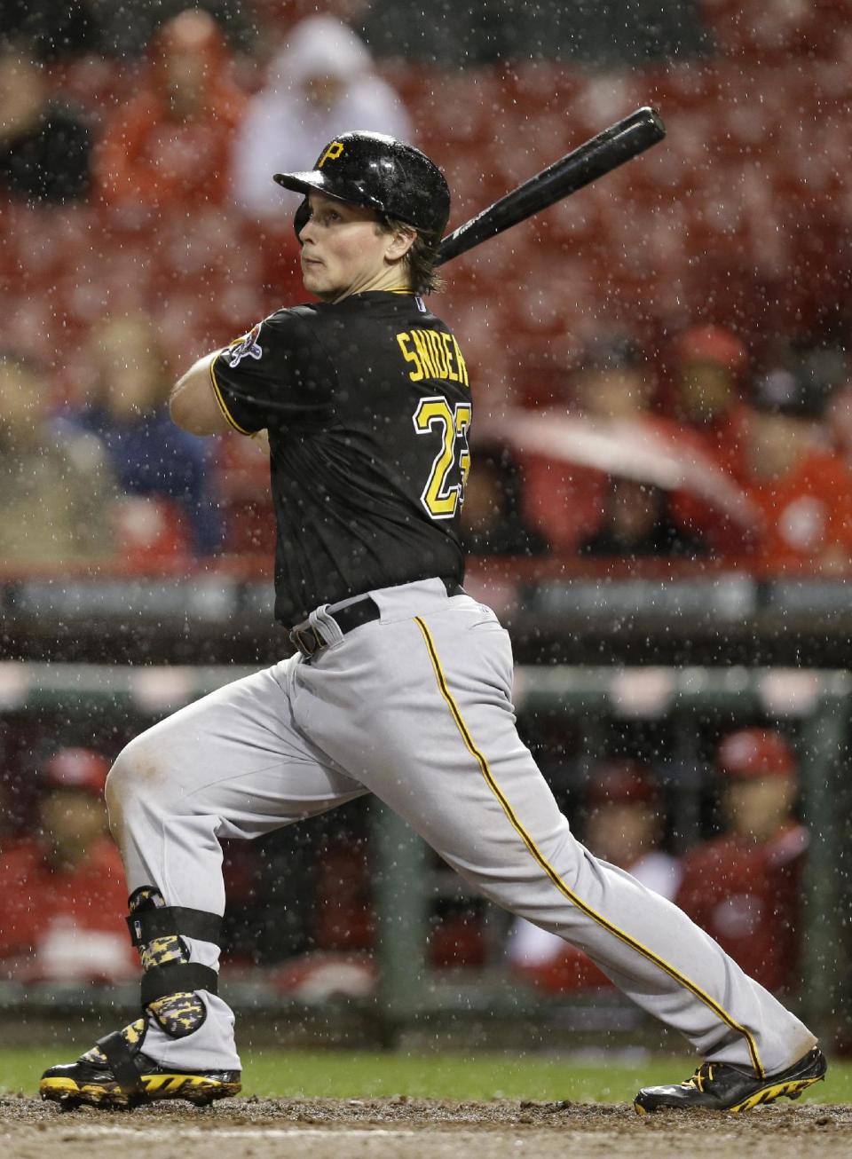 Pittsburgh Pirates' Travis Snider hits a solo home run off Cincinnati Reds starting pitcher Homer Bailey in the fifth inning of a baseball game, Monday, April 14, 2014, in Cincinnati. (AP Photo/Al Behrman)