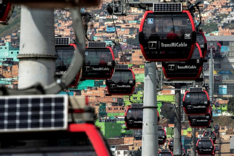 The inauguration of the TransMiCable cable car in 2018 has forever changed Ciudad Bolivar, many of whose residents work in other parts of Bogota (Alejandro MARTINEZ)
