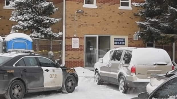 Police investigators are shown outside Gardiner's home in Collingwood, Ont., in January 2019 after the home invasion during which two of the intruders were fatally shot.