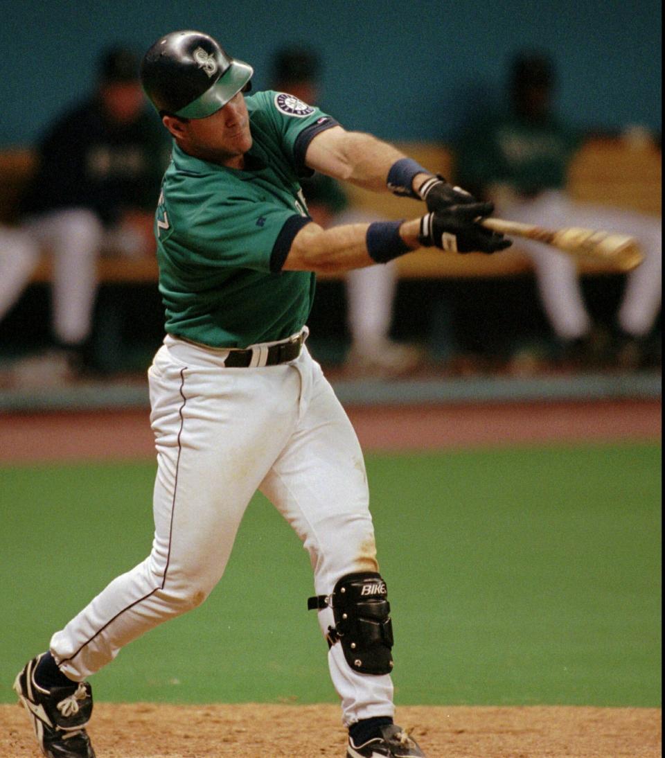 File-This June 16, 1996 file photo shows Seattle Mariners' Edgar Martinez connecting while at bat against the Chicago White Sox in Seattle. Martinez was a .312 hitter over 18 seasons with Seattle. He got 85.4 percent in his 10th and final try on the writers’ ballot. He and Baines will join 2014 inductee Frank Thomas as the only Hall of Famers to play the majority of their games at designated hitter. David Ortiz will be eligible in 2022. (AP Photo/Elaine Thompson, File)