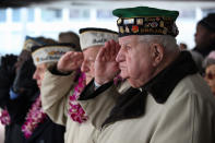 Pearl Harbor survivors attend a ceremony commemorating the 71st anniversary of the Japanese attacks on Pearl Harbor on December 7, 2012 in New York City. World War II veterans from the New York metropolitan area participated in a wreath-laying ceremony next to the Intrepid Sea, Air and Space Museum, which was damaged in Hurricane Sandy and is undergoing repairs. (Photo by John Moore/Getty Images)