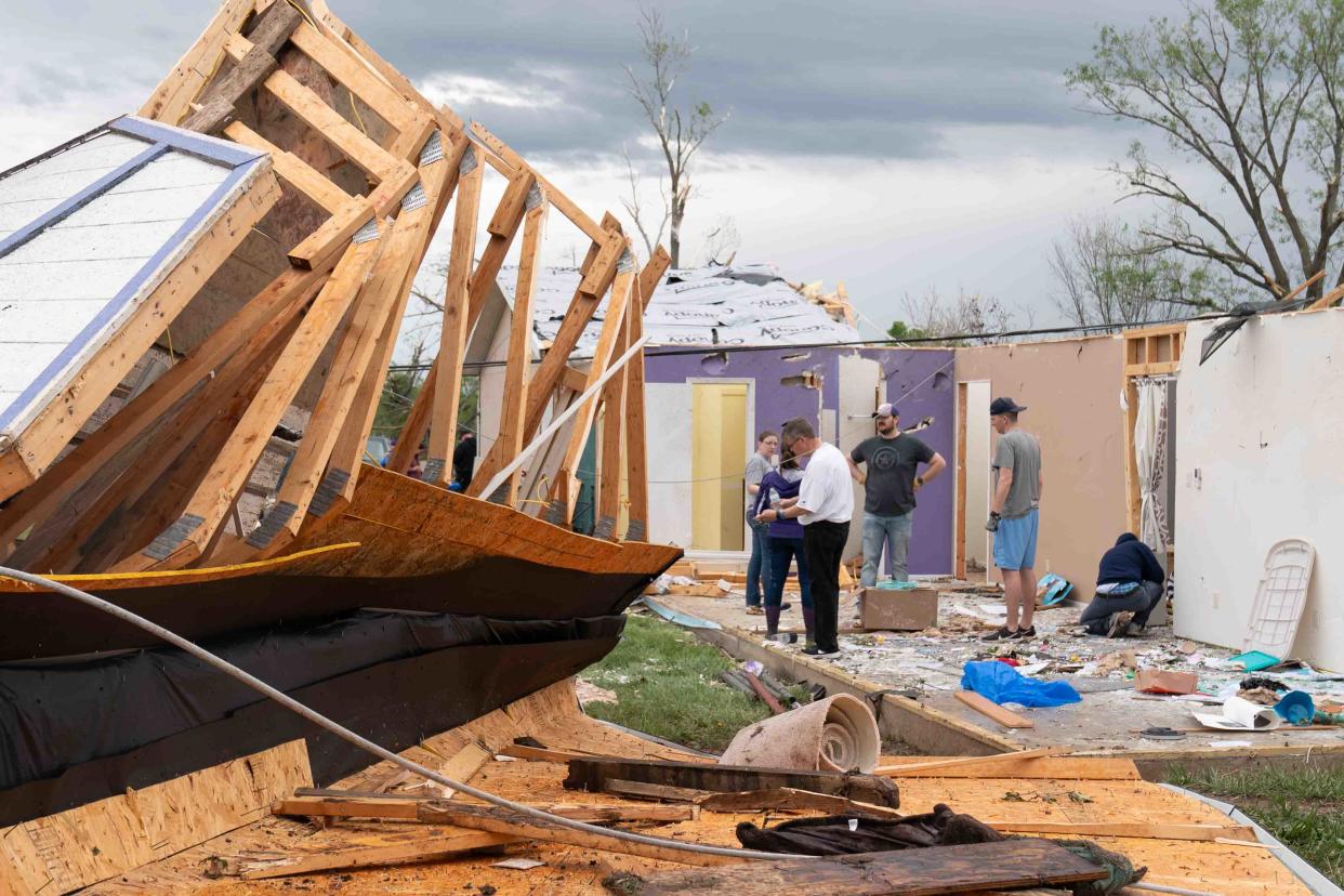 Damage to the Westmoreland home of Ashley and J.T. Van Gilder can be seen Wednesday morning as the family cleans up debris left from a tornado that struck Tuesday.