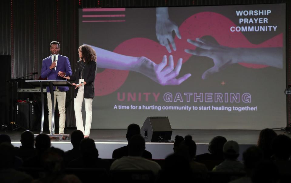 Deante and Arnalesa Lavender speak during a unity gathering at The Remedy Church on Tuesday in Akron.