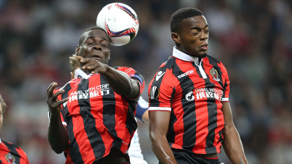 Mario Balotelli and Wylan Cyprien jumping for a header together