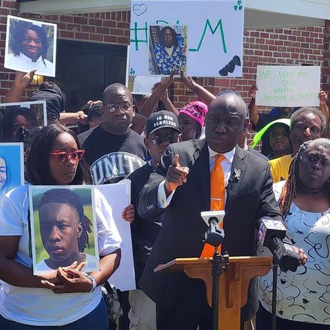 <p>Ben Crump Law</p> Civil rights lawyer Ben Crump (at podium), surrounded by Kadarius Smith's mother (left, in the red glasses) and other supporters at a press conference outside New Zion Baptist Church in Leland, Miss., April 16, 2024.