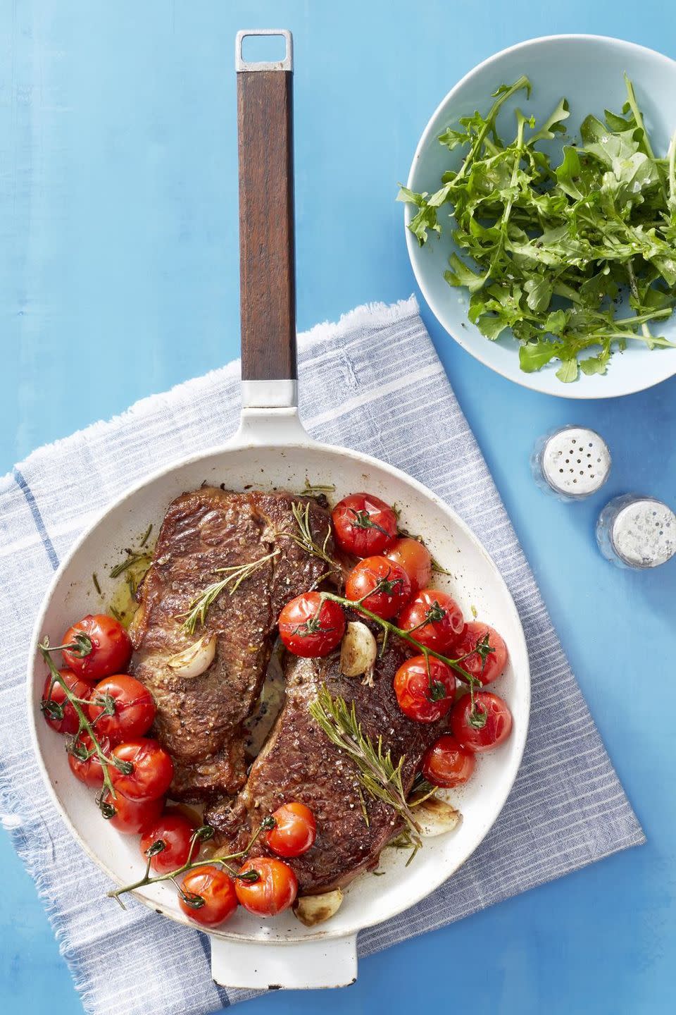 <p>Grilled tomatoes and a side salad add some light, fresh flavor to this steak dinner.</p><p>Get the <strong><a href="https://www.goodhousekeeping.com/food-recipes/easy/a22729431/seared-steak-with-blistered-tomatoes-recipe/" rel="nofollow noopener" target="_blank" data-ylk="slk:Seared Steak with Blistered Tomatoes recipe;elm:context_link;itc:0;sec:content-canvas" class="link ">Seared Steak with Blistered Tomatoes recipe</a></strong>. </p>