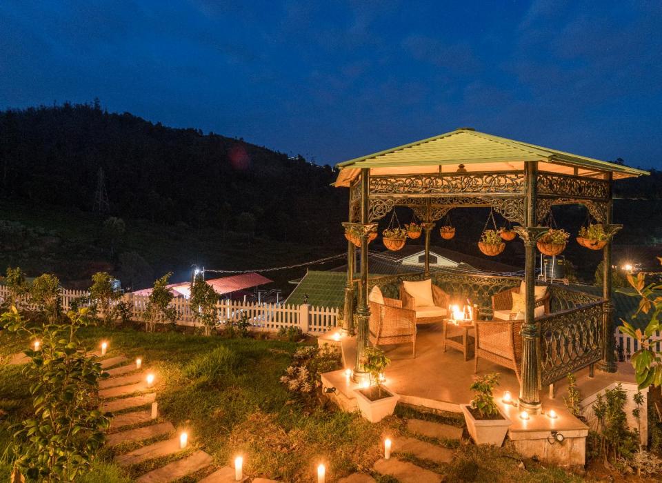 The gazebo is heavenly with green hills around and blue skies above.