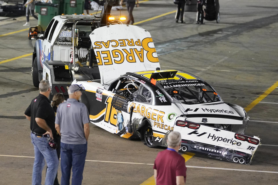 The car of winning driver AJ Allmendinger is towed away after Allmendinger crashed with Austin Cindric at the finish line during a NASCAR Xfinity Series auto race at Bristol Motor Speedway Friday, Sept. 17, 2021, in Bristol, Tenn. (AP Photo/Mark Humphrey)