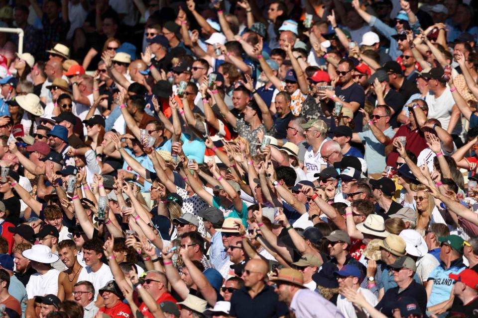 England fans indicate a six from their seats during the third T20 international cricket match between England and New Zealand at Edgbaston, in Birmingham, central England, on Sept. 3, 2023.
