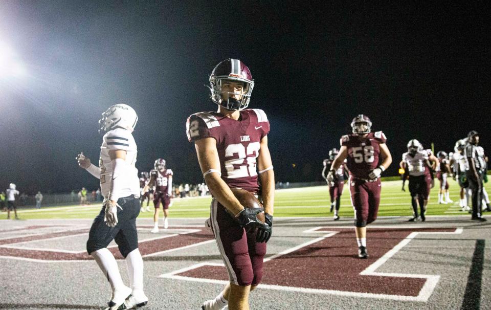 Sam Sparacio #22 of First Baptist Academy celebrates a touchdown against Moore Haven in the Class 1S-Region 4 championship at FBA Friday, Nov. 24, 2023. FBA won 35-0.