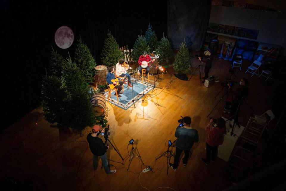The Wells family, including Carrie Wells, her husband Matthew, and her brother, Jesse, perform during the taping of Red Barn Radio’s Christmas special, An Appalachian Christmas, in Lexington, Ky., on Wednesday, Dec. 2, 2020.