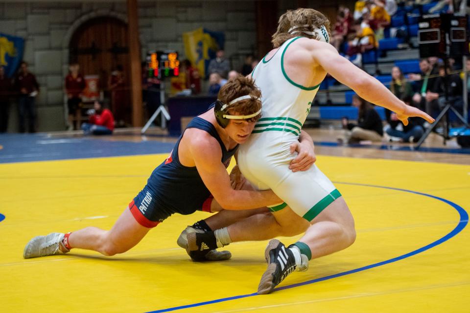 Braxton Schaefer of Heritage Hills and Cale Johnson of Evansville North compete in the 182-pound championship match during the 2023 IHSAA Regional Wrestling tournament at Castle High School in Newburgh, Ind., Saturday afternoon, Feb. 4, 2023.