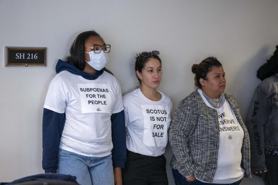 Activists with the Center for Popular Democracy Action stand outside a mark up business meeting of the Senate Judiciary Committee, on Capitol Hill, Thursday, Nov. 9, 2023, in Washington. (AP Photo/Alex Brandon)