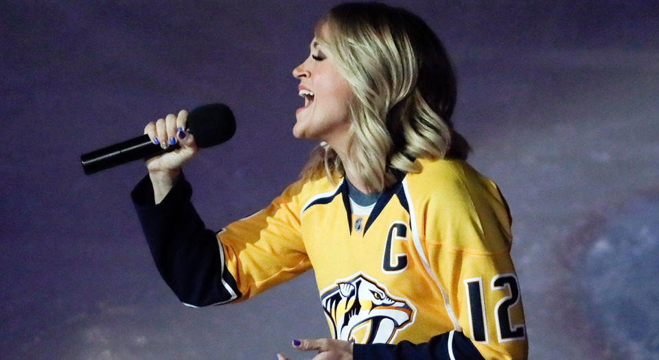 <p>Country singer Carrie Underwood, the wife of Nashville centre Mike Fisher, sings the national anthem during Round 1 against the Blackhawks,<br> (Mark Humphrey/AP) </p>