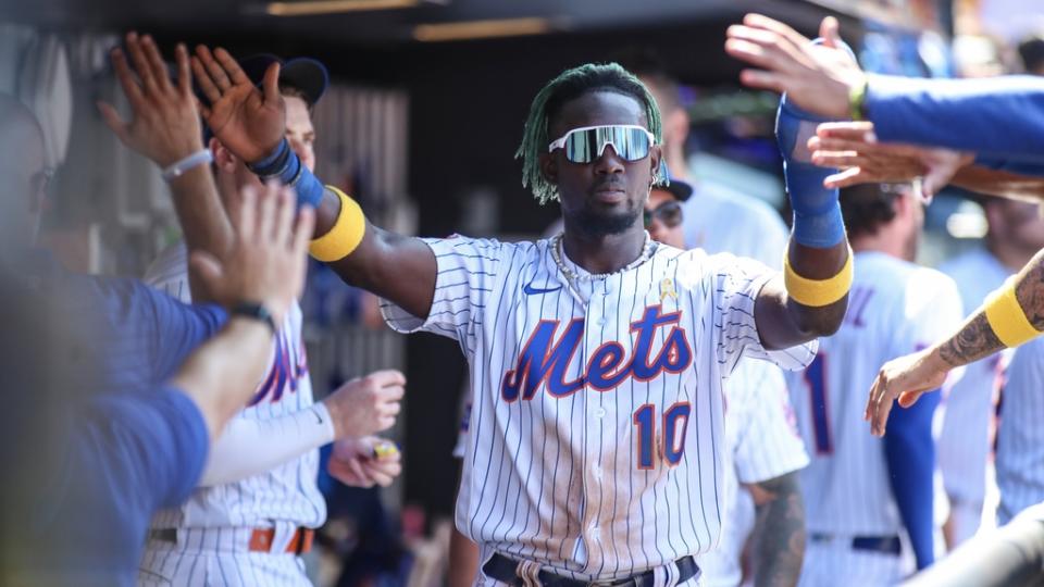 Sep 3, 2023; New York City, New York, USA; New York Mets second baseman Ronny Mauricio (10) is greeted in the dugout after scoring in the second inning against the Seattle Mariners at Citi Field.