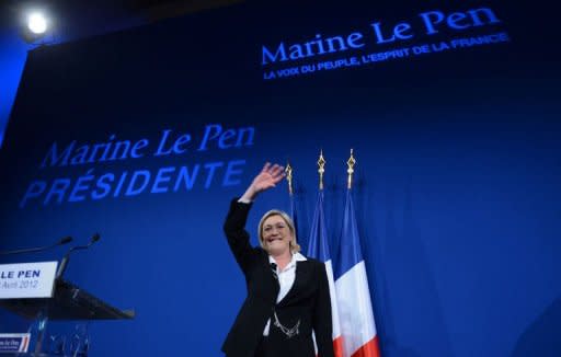 French far right party Front National (FN) candidate Marine Le Pen celebrates with supporters during the election night rally of her party on the evening of the first round of the 2012 French Presidential election on April 22, 2012 in Paris. Le Pen won 18.2 to 20 percent in Sunday's first-round, official estimates said, the highest ever score for her anti-immigrant party