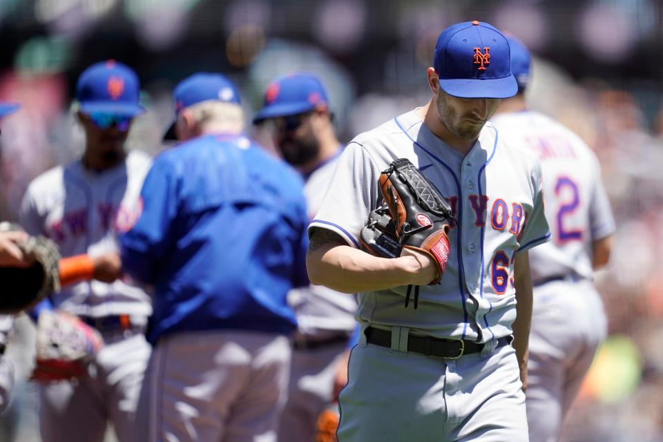 New York Mets pitcher Thomas Szapucki walks toward the dugout after being relieved during the second inning of a baseball game against the San Francisco Giants in San Francisco, Wednesday, May 25, 2022.