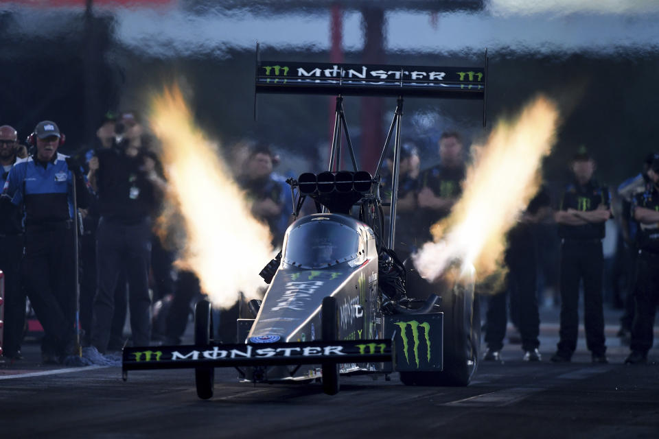 In this photo provided by the NHRA, Brittany Force drives in Top Fuel qualifying Friday, April 22, 2022, during the NHRA SpringNationals drag races at Houston Raceway Park in Baytown, Texas. (Marc Gewertz/NHRA via AP)