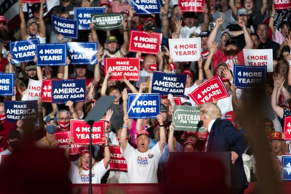 Trump looks on at the largely maskless crowd (Getty Images)