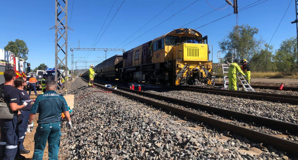 Rescue personnel attending the scene of a train collision near Westwood, 50km west of Rockhampton. Source: AAP