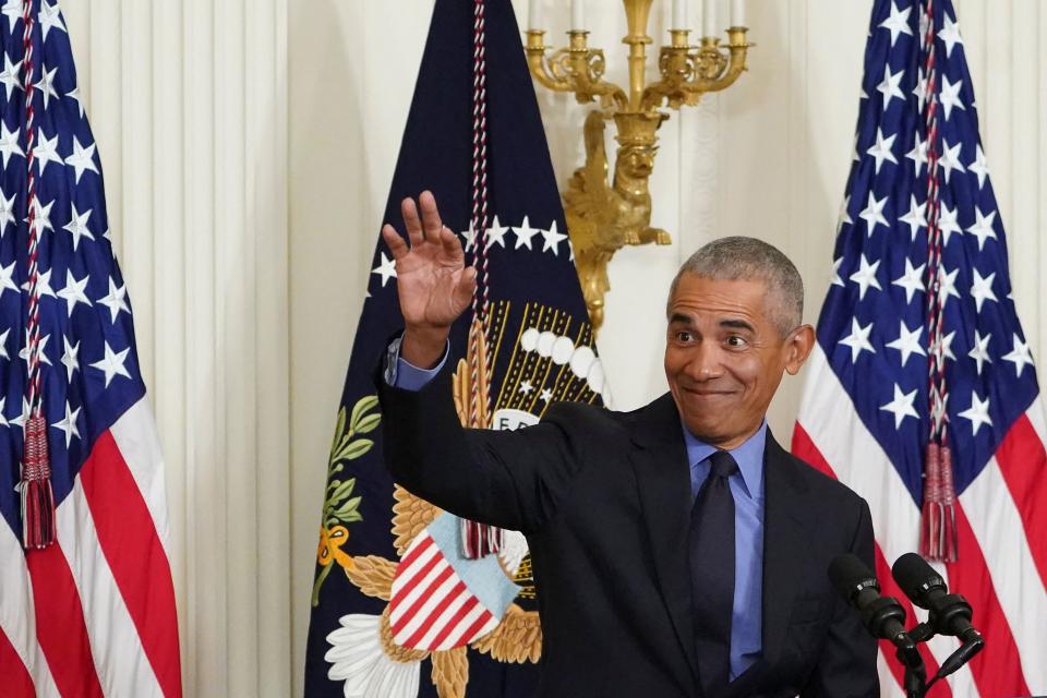 Former President Obama waves as he arrives to deliver remarks on the Affordable Care Act and Medicaid at the White House on April 5, 2022. (Photo by MANDEL NGAN/AFP)