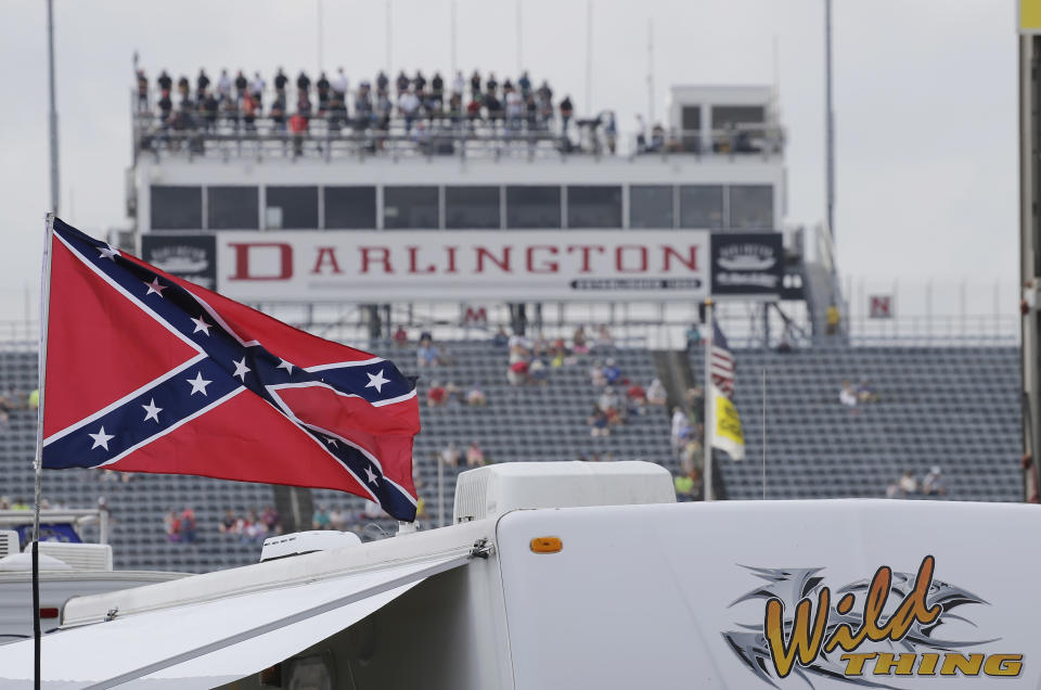 A Confederate flag flies in the infield before a NASCAR Xfinity auto race at Darlington Raceway in Darlington, S.C., Saturday, Sept. 5, 2015. (AP Photo/Terry Renna)