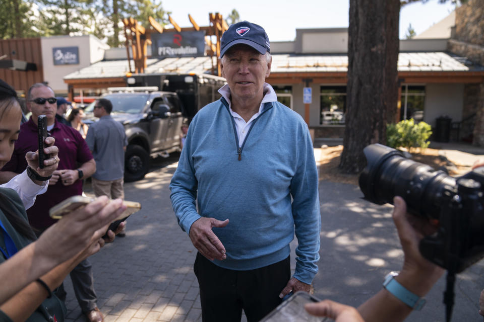 President Joe Biden talks with reporters after taking a Pilates and spin class at PeloDog, Friday, Aug. 25, 2023, in South Lake Tahoe, Calif. (AP Photo/Evan Vucci)