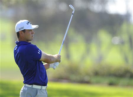 Jan 25, 2014; La Jolla, CA, USA; Gary Woodland hits his second shot on the fourteenth hole during the third round of the Farmers Insurance Open golf tournament at Torrey Pines Municipal Golf Course - South Co. Mandatory Credit: Christopher Hanewinckel-USA TODAY Sports