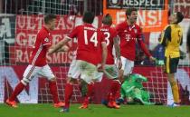 Football Soccer - Bayern Munich v Arsenal - UEFA Champions League Round of 16 First Leg - Allianz Arena, Munich, Germany - 15/2/17 Bayern Munich's Thomas Muller celebrates scoring their fifth goal with teammates Reuters / Michael Dalder Livepic