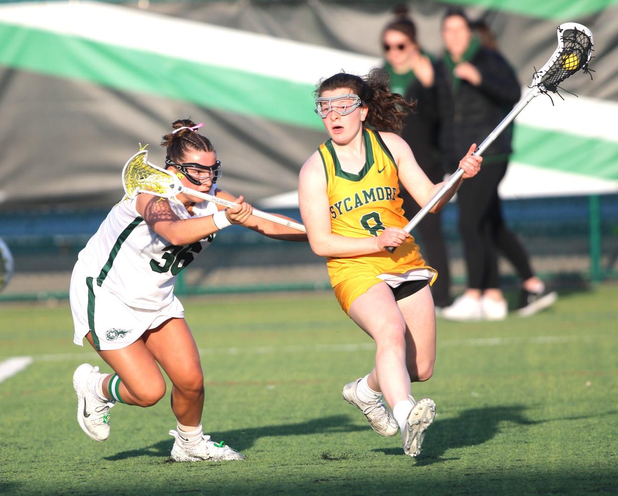 Mason senior Izzy Dean (36) pressures Sycamore junior Jordana Ronis-Tobin (8) as Sycamore defeated Mason 16-3 Thursday.