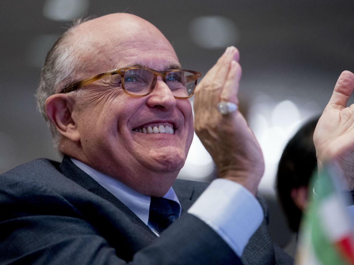 Rudy Giuliani applauds at the Iran Freedom Convention for Human Rights and democracy at the Grand Hyatt in Washington: AP Photo/Andrew Harnik