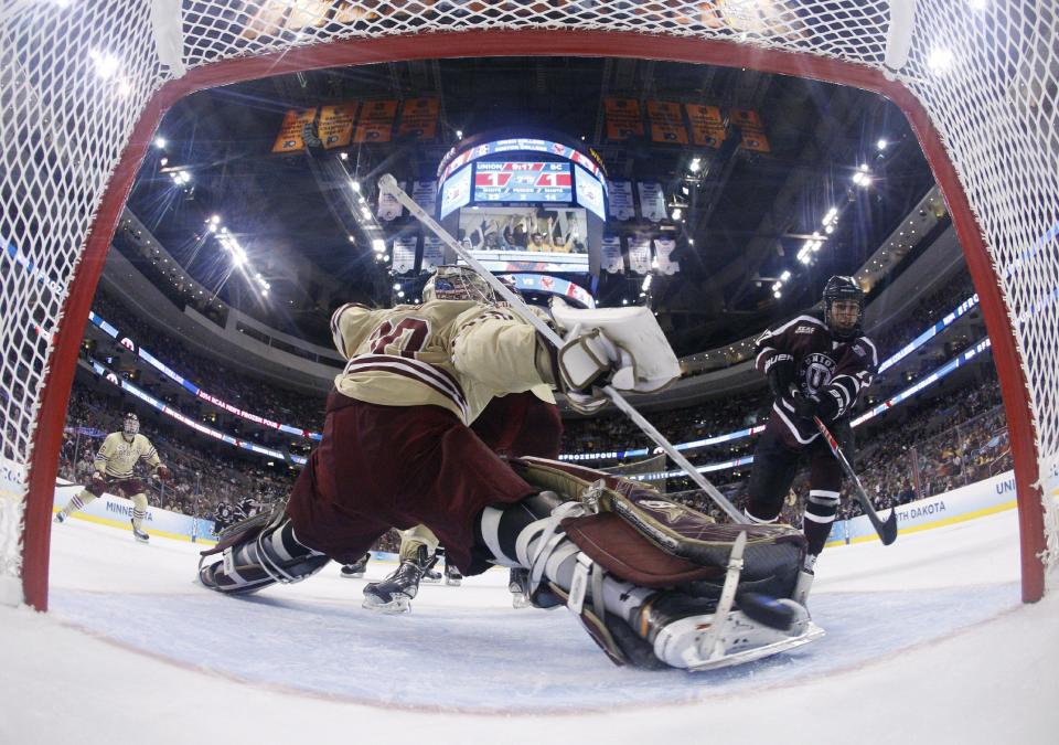 Union's Daniel Ciampini, right, shoots the puck past Boston College's Thatcher Demko for a goal during the second period of an NCAA men's college hockey Frozen Four tournament semifinal, Thursday, April 10, 2014, in Philadelphia. (AP Photo/Chris Szagola)