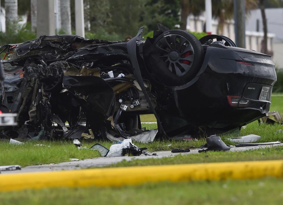 The Florida Highway Patrol investigates a quadruple fatal traffic crash on U.S. 1 north of the Roosevelt Bridge near Northwest Baker Road on Tuesday, Oct. 18, 2022, in Martin County. The crash involved a 2017 red Chrysler minivan and a 2022 black Tesla sedan, each of which were transporting two people. Both drivers and both passengers died, said Martin County Chief Deputy John Budensiek.