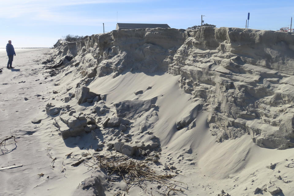 FILE - This Jan. 22, 2024, photo shows a severely eroded section of sand dune in North Wildwood N.J. On April 25, 2024, North Wildwood and the state of New Jersey announced an agreement for an emergency beach replenishment project there to protect the city until a full-blown beach fill can be done by the U.S. Army Corps of Engineers that may still be two years away. Winter storms punched a hole through what is left of the city's eroded dune system, leaving it more vulnerable than ever to destructive flooding. (AP Photo/Wayne Parry, File)