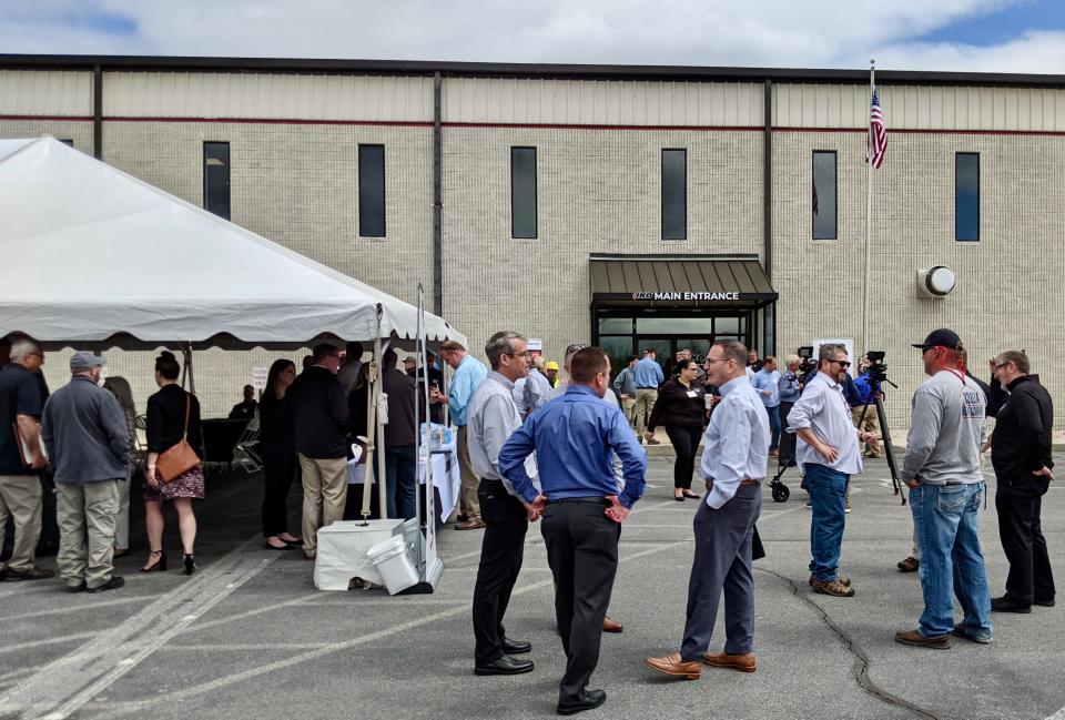 Customers, company leaders and government and civic officials attended the grand opening of IKO's Hagerstown plant Thursday.