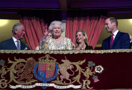 Britain's Queen Elizabeth waves next to Prince Charles and PrinceÊWilliam, Duke of Cambridge, during a special concert "The Queen's Birthday Party" to celebrate her 92nd birthday at the Royal Albert Hall in London, Britain April 21, 2018. Andrew Parsons/Pool via Reuters