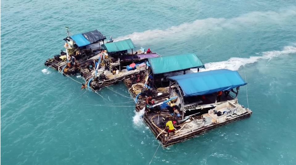 Makeshift pontoons in the Indonesian Sea form an illegal tin mine