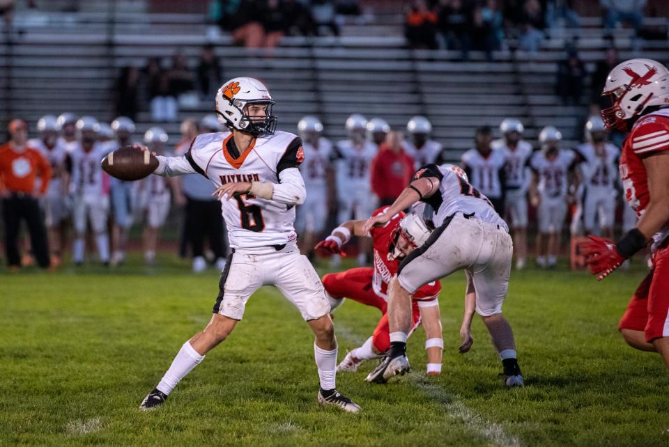 Maynard/AMSA senior captain and quarterback Dylan Gallo goes back to pass during the game against Hudson at Morgan Bowl, Oct. 5, 2024. The Hawks defeated the Tigers, 63-28.