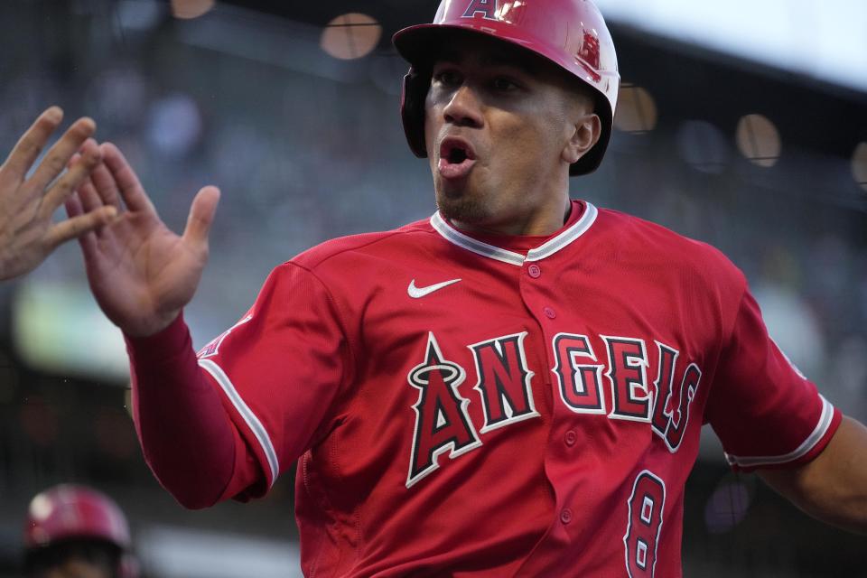 Los Angeles Angels' Kean Wong is greeted by a teammate after scoring on a double by Anthony Rendon during the fourth inning against the San Francisco Giants in a baseball game Tuesday, June 1, 2021, in San Francisco. (AP Photo/Tony Avelar)