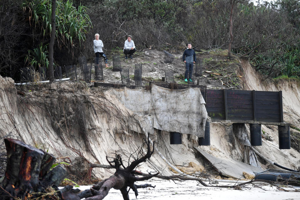 Locals inspect erosion damage to Clarkes Beach at Byron Bay.