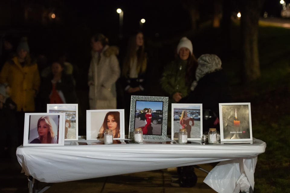 PLYMOUTH, ENGLAND - NOVEMBER 25: Family, friends and members of the public gather by Sheepstor Road bus stop for a candlelit vigil in tribute of Bobbi-Anne McLeod on November 25, 2021 in Plymouth, England. Bobbi-Anne McLeod went missing after leaving her home in Leigham in Plymouth at around 6 pm on Saturday. A murder investigation was launched after a body was found near Bovisand in South Hams on the south coast of Devon by police who had been searching for the missing 18-year-old woman. Two men are currently in police custody, arrested on suspicion of murder. (Photo by Finnbarr Webster/Getty Images)